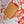 POCHETTE MÉTIS 25 IN CORAL MONOGRAM TILES CANVAS GOLD HARDWARE