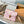 POCHETTE MÉTIS 25 IN CORAL MONOGRAM TILES CANVAS GOLD HARDWARE