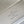 CAPUCINES EAST-WEST MINI 22 IN WHITE CALFSKIN SILVER HARDWARE