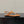 THONG SANDAL IN GINGER ORANGE CALFSKIN WITH GOLD LOGO