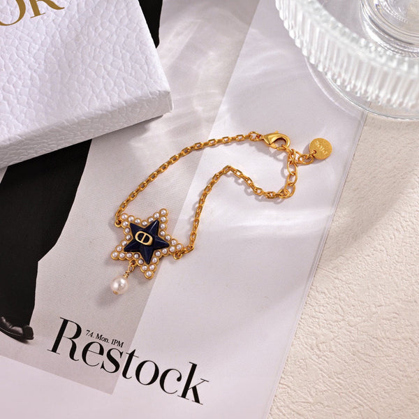 CD 26S Pearl Star Logo Charm Bracelet In Gold Tone Metal