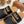CHLOÉ WOODY WEDGE SANDALS IN BLACK CANVAS WITH CIDER BROWN RUBBER SOLE