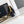 CC MINI 13 CLUTCH WITH STRAP IN BLACK LAMBSKIN ATTACH BOW