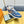 NEO RUN AWAY SNEAKER IN CLASSIC BLUE MONOGRAM DENIM AND ORANGE CALFSKIN