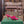 BOW-EMBELLISHED HIGH MULES IN HOT PINK SHEEPSKIN