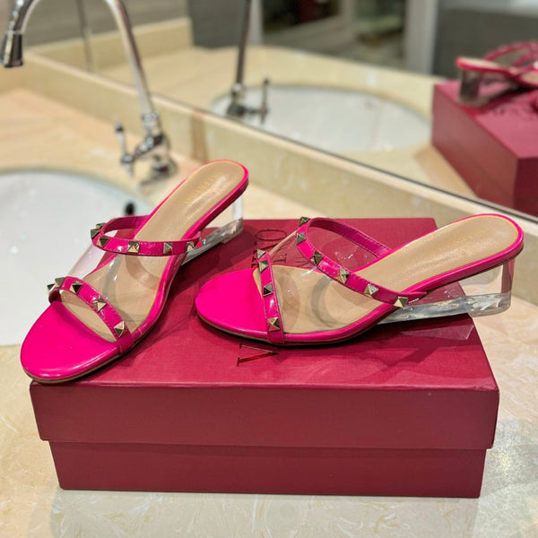 ROCKSTUD MULE SANDALS IN BRIGHT PINK CALFSKIN AND TRANSPARENT PVC FILM