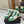 MID-TOP SNEAKERS IN WHITE PERFORATED LAMBSKIN AND GREEN SUEDE