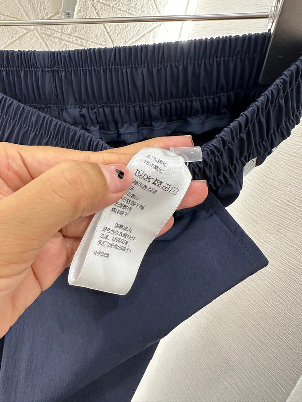 MIUMIU HIGH-WAISTED WIDE-LEG PANTS WITH BOW 276652