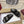 SANDALS IN BLACK SUEDE EMBOSSED LOGO SILVER HARDWARE