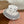 MM BUCKET IN WHITE FABRIC WITH BLACK EMBROIDERED PATTERN